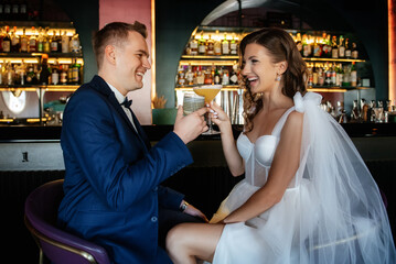 bride and groom inside a cocktail bar