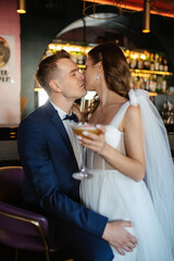 bride and groom inside a cocktail bar