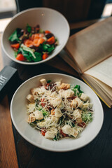 salad with fish and vegetables on table in cafe