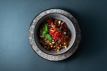 bowl red chili with noodles