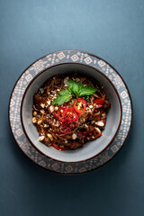 bowl red chili with noodles