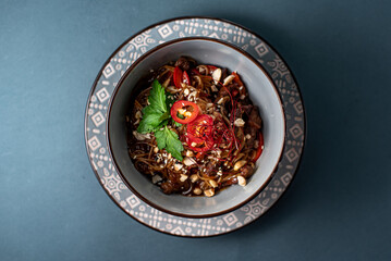 bowl red chili with noodles