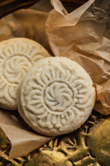 close up of maamoul (ma'amoul), date-filled butter cookies with a decorative pattern. Ma'amoul is a popular dessert throughout the Middle East for holidays such as Easter or Eid.