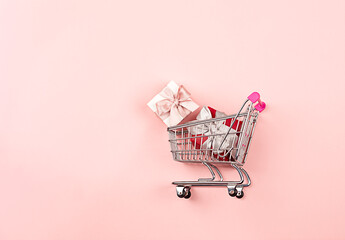 a cart full of gifts, wrapped gift boxes, surprise gift, concept of preparing gifts for celebrations, congratulations on Valentine's Day, happy birthday, mother's day, March 8
