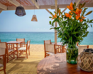 a terrace of a restaurant or cafeteria, resort, overlooking the sea, sunny day, concept of travel,...