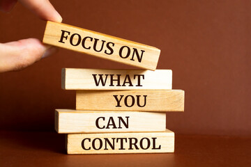 Wooden blocks with words 'Focus on what you can control'.