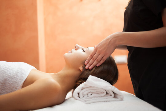 Beautiful woman having an head massage