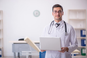 Young male doctor in telemedicine concept