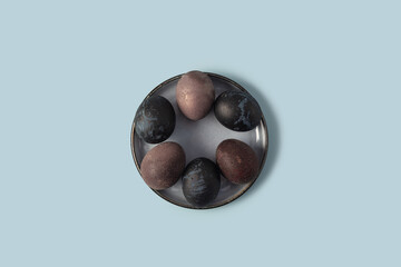 Blue and purple easter eggs on a blue background