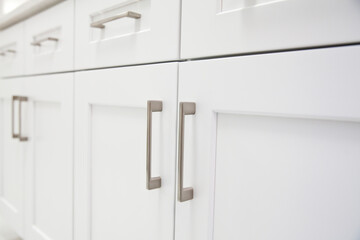 Close up view of white kitchen cabinet - obrazy, fototapety, plakaty