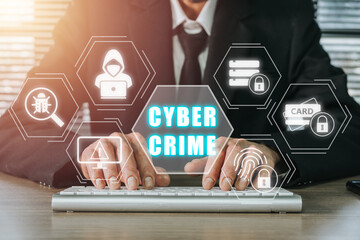 Cyber crime concept, Person hand typing keyboard computer with cyber crime icon on virtual screen.