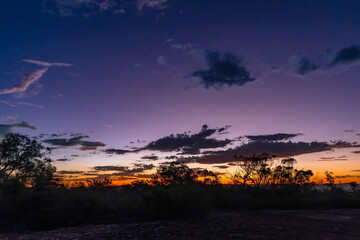 Twilight sky with clouds and trees out in the bush