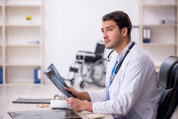 Young male doctor radiologist working in the clinic