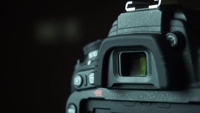 Closeup of DSLR camera viewfinder and camera buttons