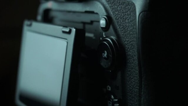 Closeup of DSLR camera LCD and camera buttons