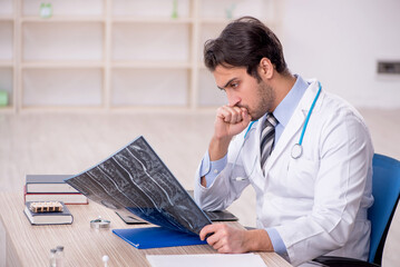 Young male doctor radiologist working in the clinic