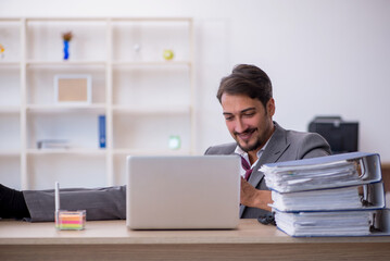 Young male employee working in the office