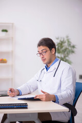 Young male doctor working in the clinic