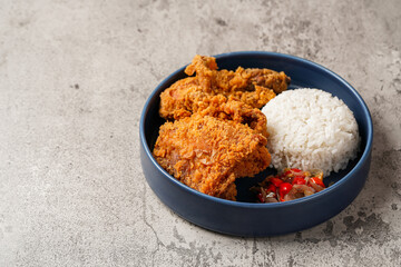 Ayam Geprek is an Indonesian Food crispy fried chicken with hot and spicy sambal Chili Sauce.
