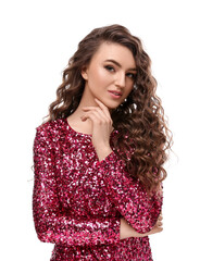 Beautiful young woman with long curly brown hair in pink sequin dress on white background