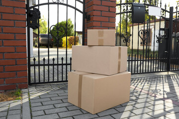 Naklejka na ściany i meble Stack of parcels delivered near front gates