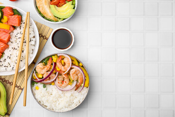 Set of delicious poke bowls with different ingredients on white table, flat lay. Space for text