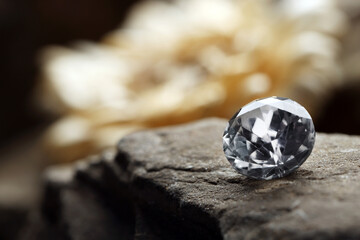 Beautiful gemstone for jewelry on stone surface, closeup. Space for text