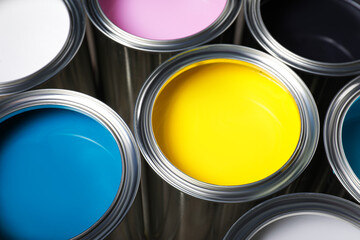 Open cans of different paints as background, closeup
