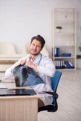 Young male doctor radiologist working in the clinic