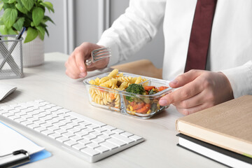 Plakat Office employee having business lunch at workplace, closeup