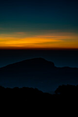 The beautiful sunrise at Doi intanon national park, Chiang Mai in the morning.Sun is rising from the hill to shy with beautiful yellow orange light.