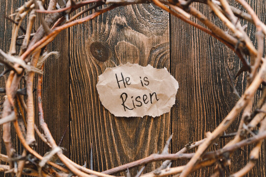 He is Risen. Jesus Crown Thorns and nails and cross on a wood background. Crucifixion Of Jesus Christ. Passion Of Jesus Christ. Concept for faith, spirituality and religion. Easter Day