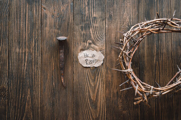 He is Risen. Jesus Crown Thorns and nails and cross on a wood background. Crucifixion Of Jesus...