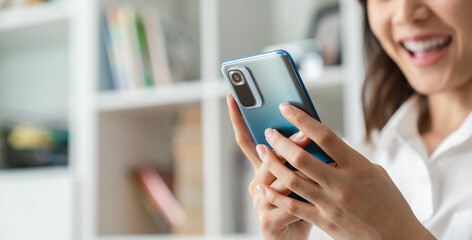 Woman holding a smartphone and using online social on lifestyle. Technology for communication concept.