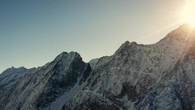 Aerial drone shot of Italian Mountains in Wintertime before Senset.
Cinematic shot over Presena Italian Alps at dusk.