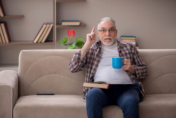 Old man sitting at home