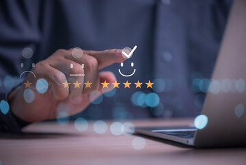 The man's finger pressed for the highest satisfaction score on the virtual screen ,Customer satisfaction rating