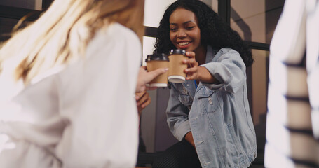 A group of female company employees are having fun chatting after work.