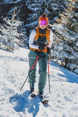 Mountaineer backcountry ski walking ski alpinist in the mountains. Ski touring in alpine landscape with snowy trees. Adventure winter sport. Kralova hola, Slovakia © Zedspider