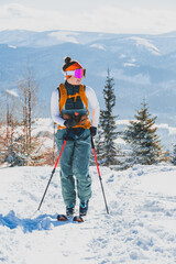 Mountaineer backcountry ski walking ski alpinist in the mountains. Ski touring in alpine landscape with snowy trees. Adventure winter sport. Kralova hola, Slovakia © Zedspider