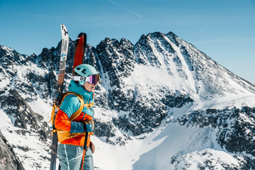 Mountaineer backcountry ski walking ski alpinist in the mountains. Ski touring in alpine landscape...
