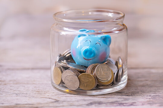 happy piggy bank with saving coins , image for saving money concept.