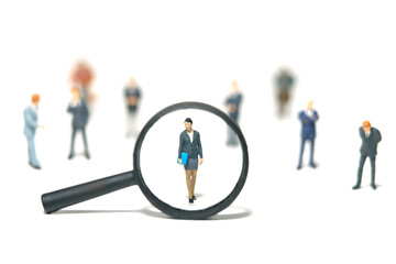 Miniature people toy figure photography. Women leader search. A businesswoman standing in the...