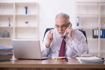 Old male employee and too much work in the office