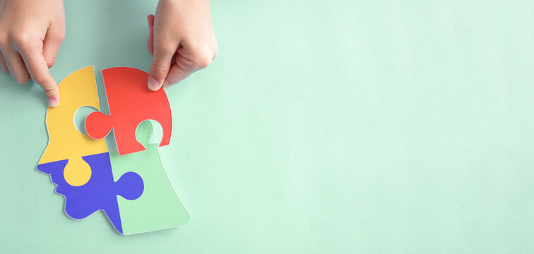 Hands holding jigsaw puzzle head shape, Autism awareness, Autism spectrum disorder (ASD), World Autism Awareness Day