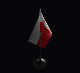 Small national flag of the Greenland on a black background