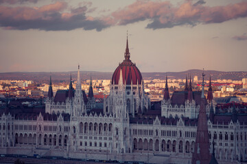 Fototapeta na wymiar Budapest parliament in magic sunset, and the Danube river, Hungary