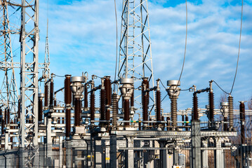 High voltage circuit breaker in a power substation.Electric power transmission lines in the evening. High voltage switchgear and equipment of power plant.