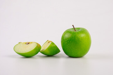 Falling green apple slice isolated on transparent background.