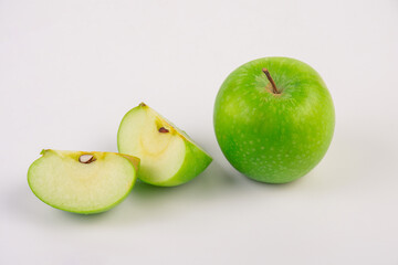 Falling green apple slice isolated on transparent background.